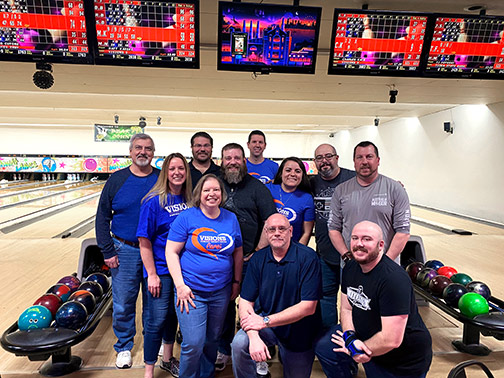 The Visions team poses for a group photo at Midway Lanes Bowling Alley after another successful win in the ACHIEVE Pin Crushing Classic.