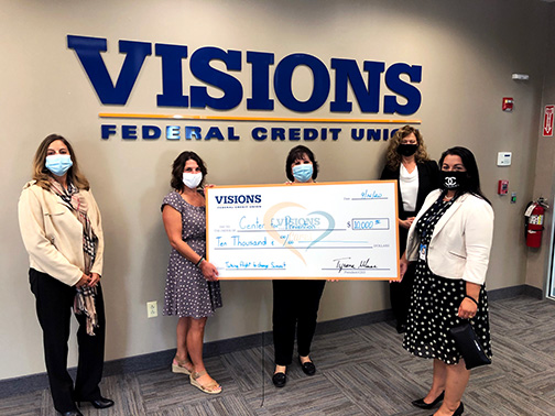 Visions awards the Center for Prevention and Counseling of Newton, NJ with a giant check for a $10,000 grant to support their Taking Flight to Change Summit.