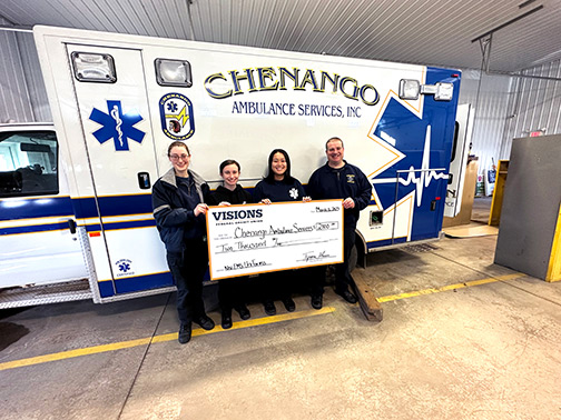Pictured are members of the Chenango Ambulance Services holding a giant check in front of ambulances that are used daily to save lives! 