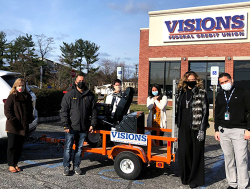 Our NJ employees stand with Brian Schwartz, founder of I Want to Mow Your Lawn, as they donate a brand new red 30-inch Troy-Bilt Snowblower to support his cause!