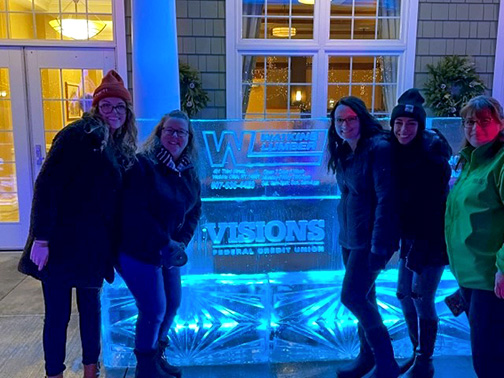 Braving the cold, our Watkins Glen branch employees pose in front of the Visions logo carved into ice! Pictured from left to right are Mallory (Member Account Specialist), Michel (Branch Manager), Brittney (Sr. Member Account Specialist), Kajla (Service and Sales Representative) and Michelle (Member Account Specialist)