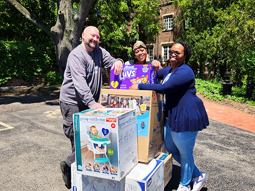 Employees from our Rochester, NY branch and a representative of Healthy Baby Network are pictured with donated baby supplies.