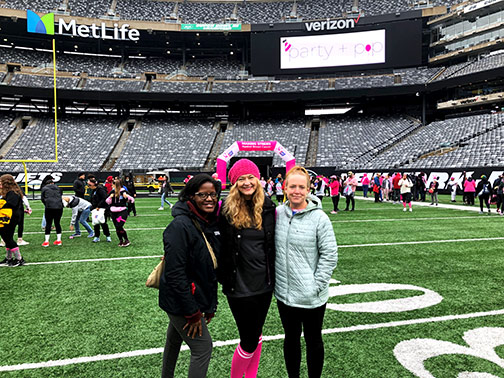 Visions employees pose at MetLife Stadium for the Making Strides Against Breast Cancer event in Bergen County.