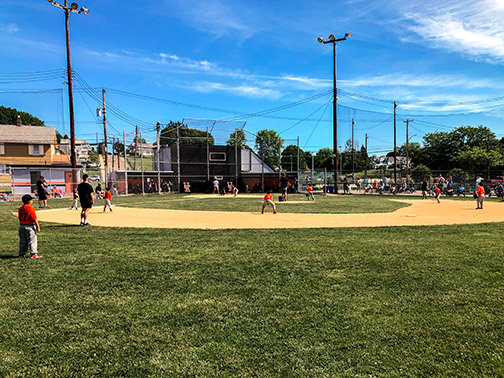 The Union-Endicott Little League team plays in the championship games on a beautiful cloudless summer day.