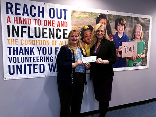 Shari Leone, Community Development Liaison from Visions Federal Credit Union presenting a $3,000 grant to the United Way of Northern New Jersey