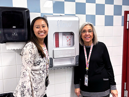 Two representatives from Leonia High School pictured in front of one of the product stations Visons helped fund the purchase of.