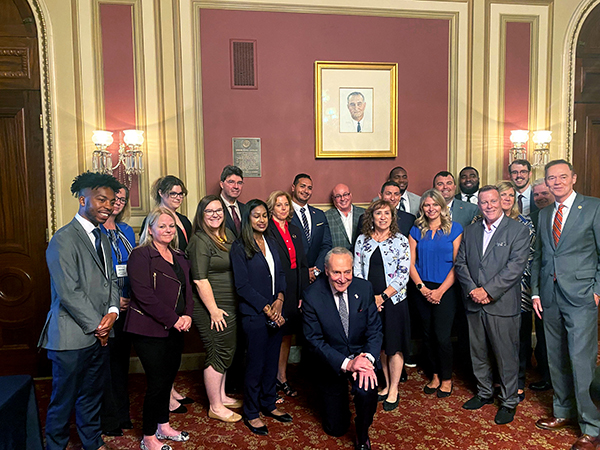 NY State Senator Chuck Schumer with NYCUA and Visions FCU staff