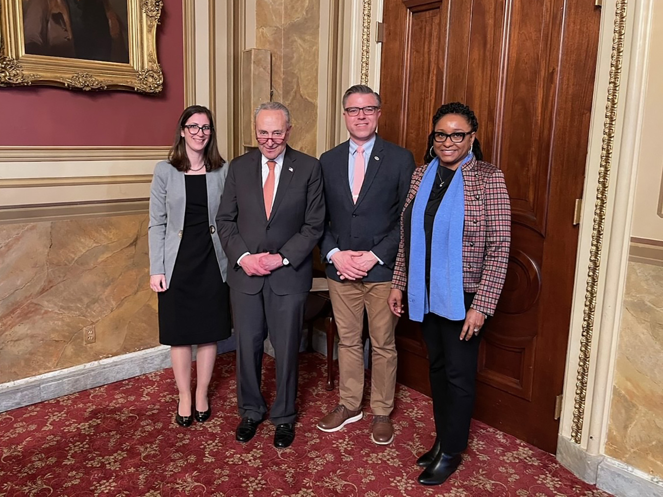 Visions Board members and employees with Senator Chuck Schumer