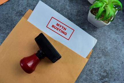 file folder with the words myths debunked on a piece of paper