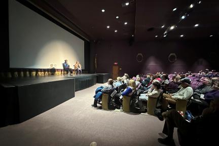 Astronaut Eileen Collins with Visions representative speaking at the Spacewoman Event