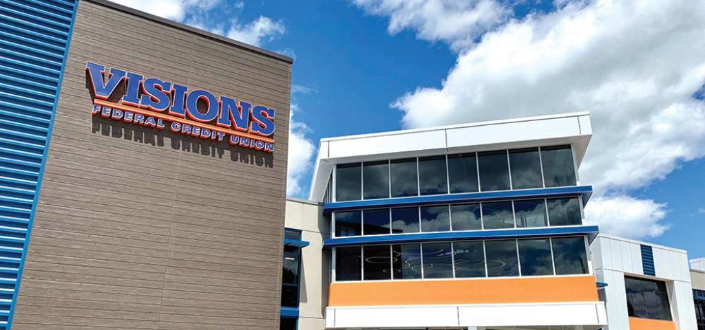 A front view of Visions Federal Credit Union headquarters featuring the Visions Federal Credit Union logo and the credit union colors accenting the architecture.