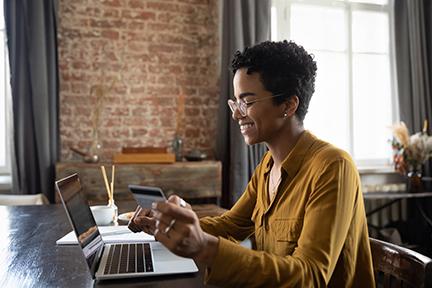 Woman with a credit card on a laptop