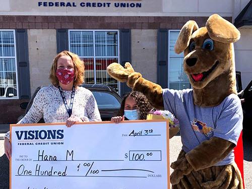 Hanna posing with Kirby Kangaroo and the Branch Manager of our Dumont office, Tammy Lamazza, with a giant check for $100