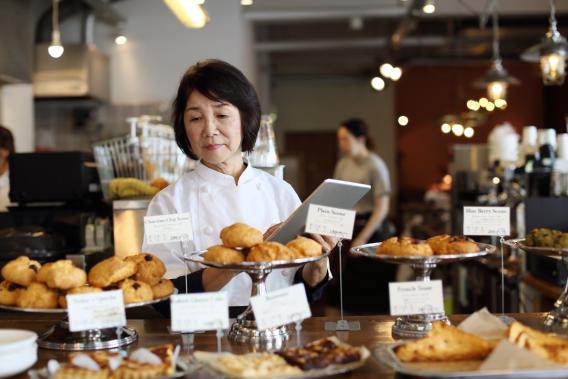 asian woman business owner in a bakery