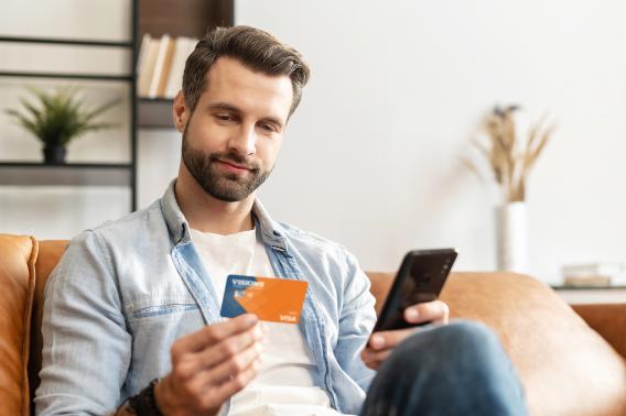 man with debit card