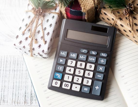 calculator and holiday gifts on a table