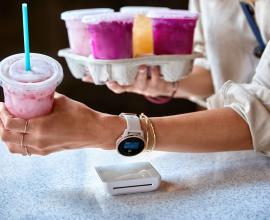 Person making contactless payment with their watch